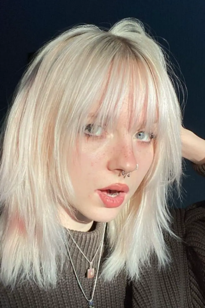 11. Razor-Cut Platinum Curtain Bangs