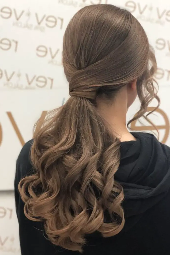 29 Cute Latina Hairstyles Long 14 12. Twisted Low Ponytail