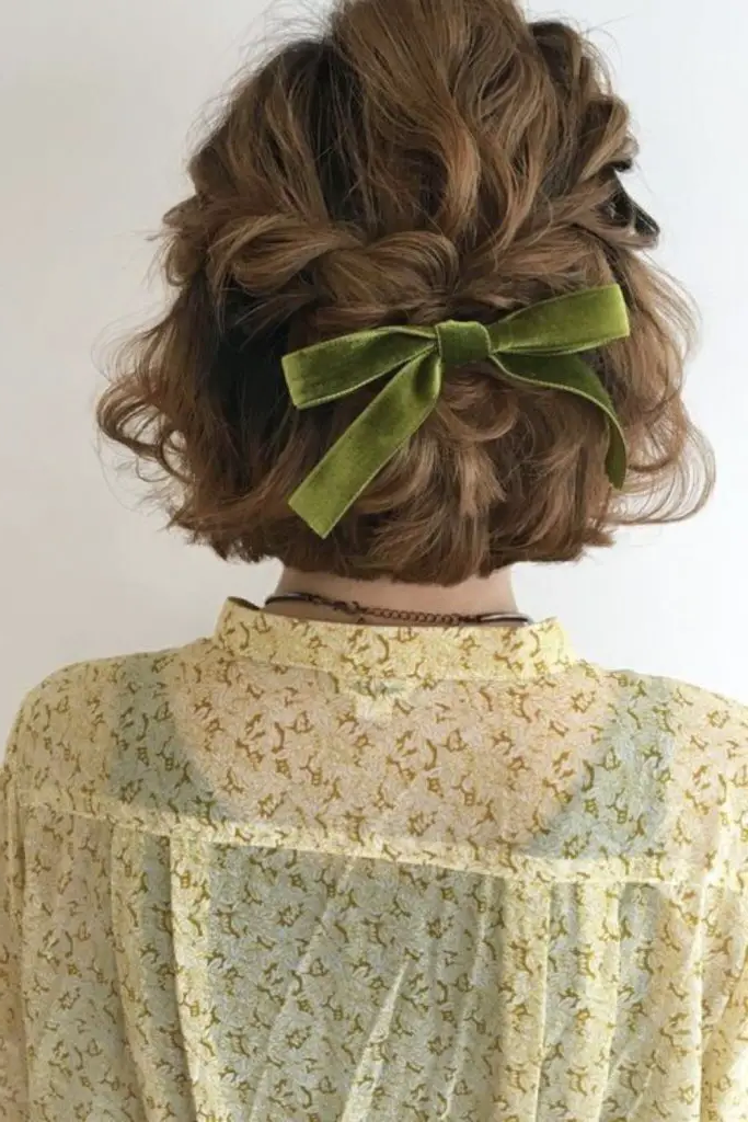 28 Cute Hairstyles with a Bow 16 14. Curled Bob with a Bow Clip