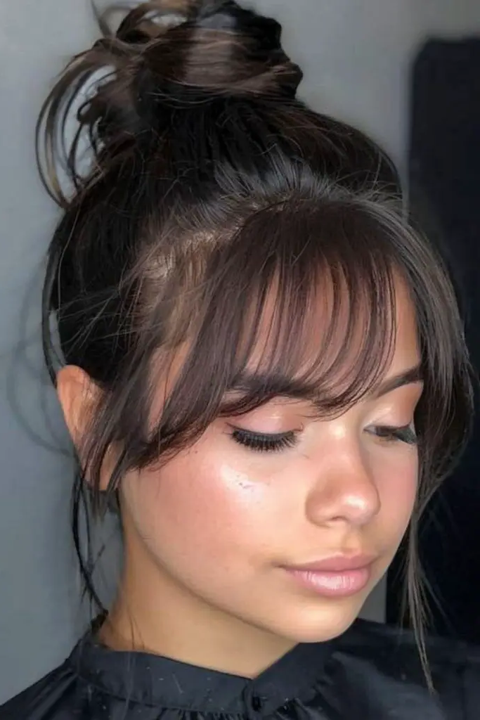 28 Best Hair for Round Face Shape Ideas 16 14. Top Knot Elegance