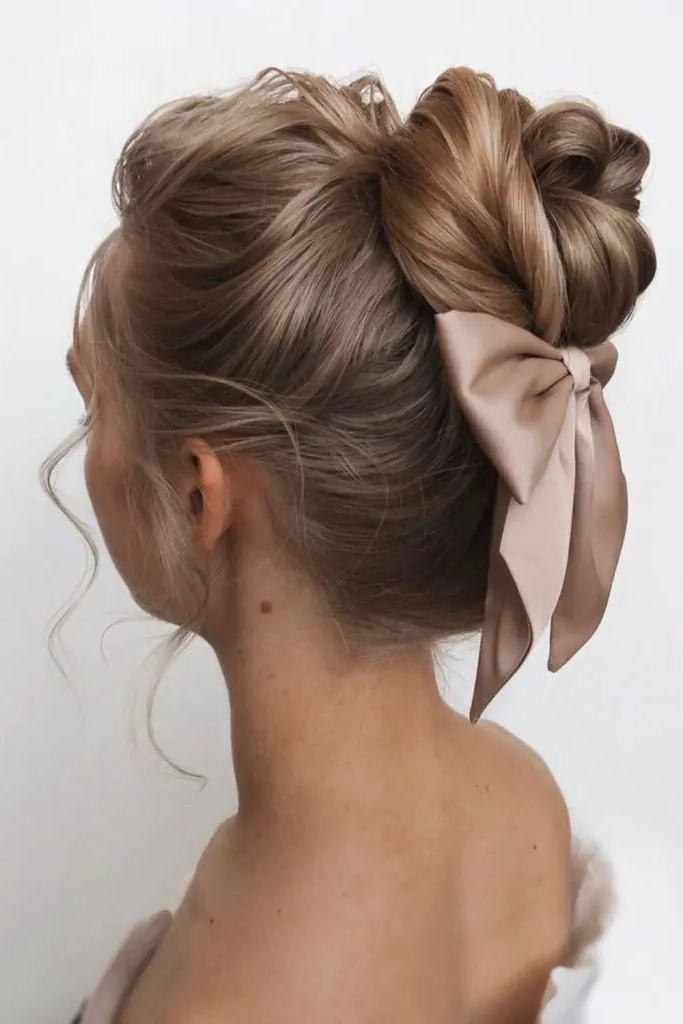 28 Cute Hairstyles with a Bow 18 16. Bow-Tied High Ballerina Bun