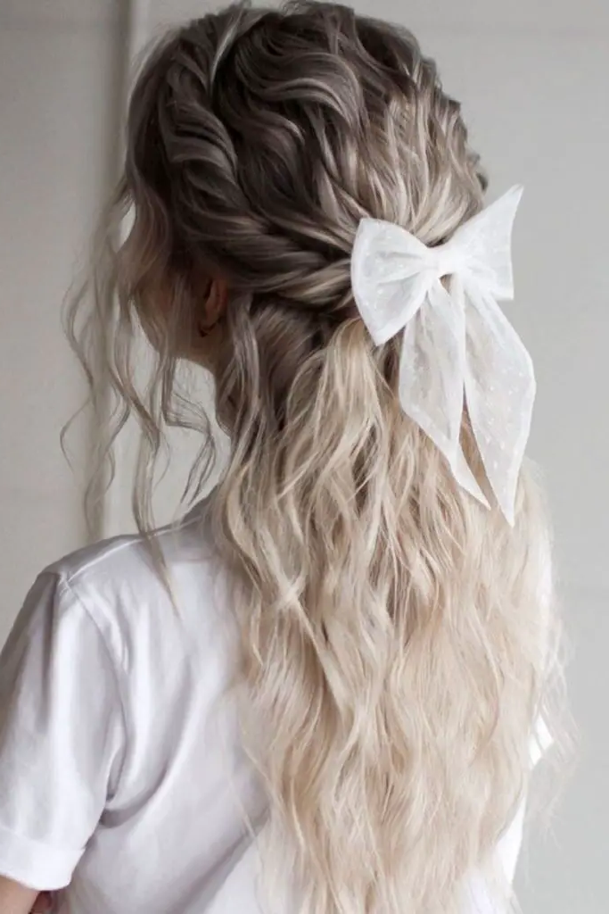 28 Cute Hairstyles with a Bow 21 19. Bow-Embellished Waterfall Braid