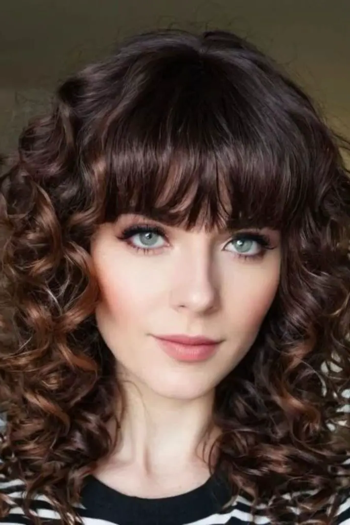 27 Cute Curly Wig Hairstyles 4 2. Fierce Feline Fringe