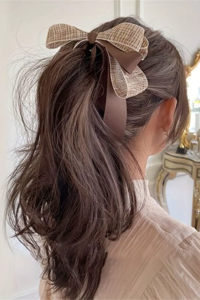 28 Cute Hairstyles with a Bow 4 2. High Ponytail with a Bow Twist