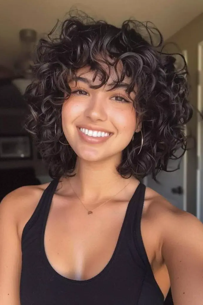 28 Stunning Medium Curly Haircuts 4 2. Wild Whirlwind Shag