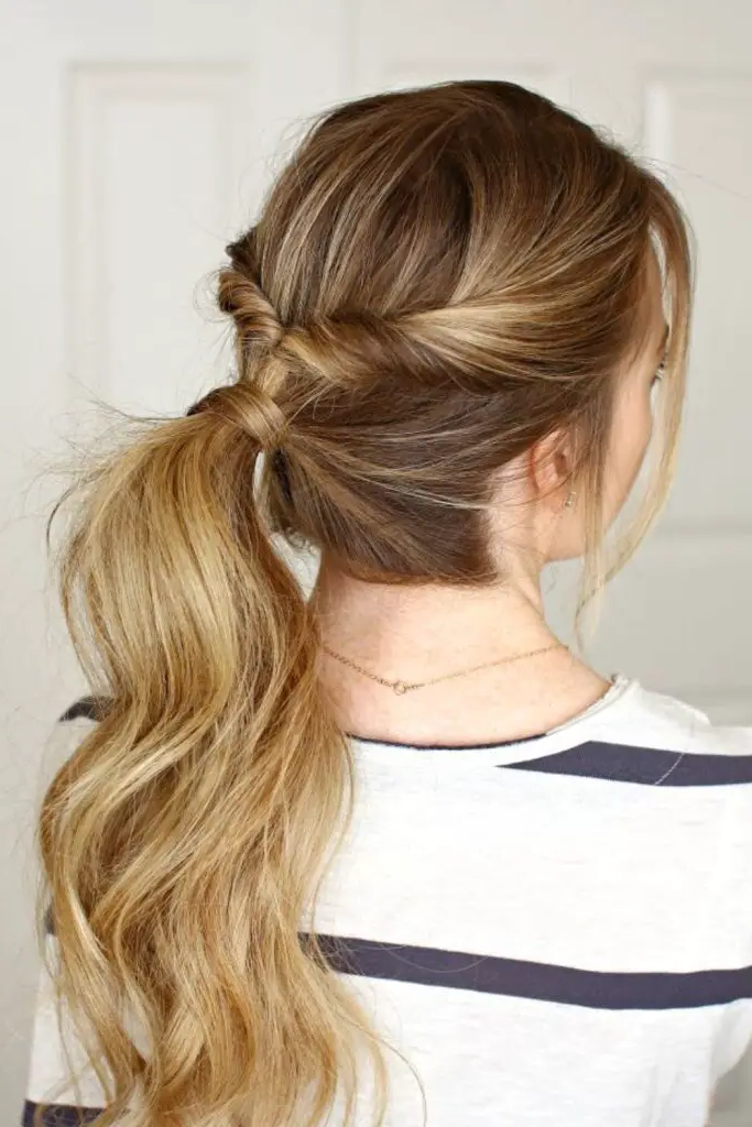 27 Simple Hairstyles for Long Hair 23 21. Elevated Flip-Twist Ponytail