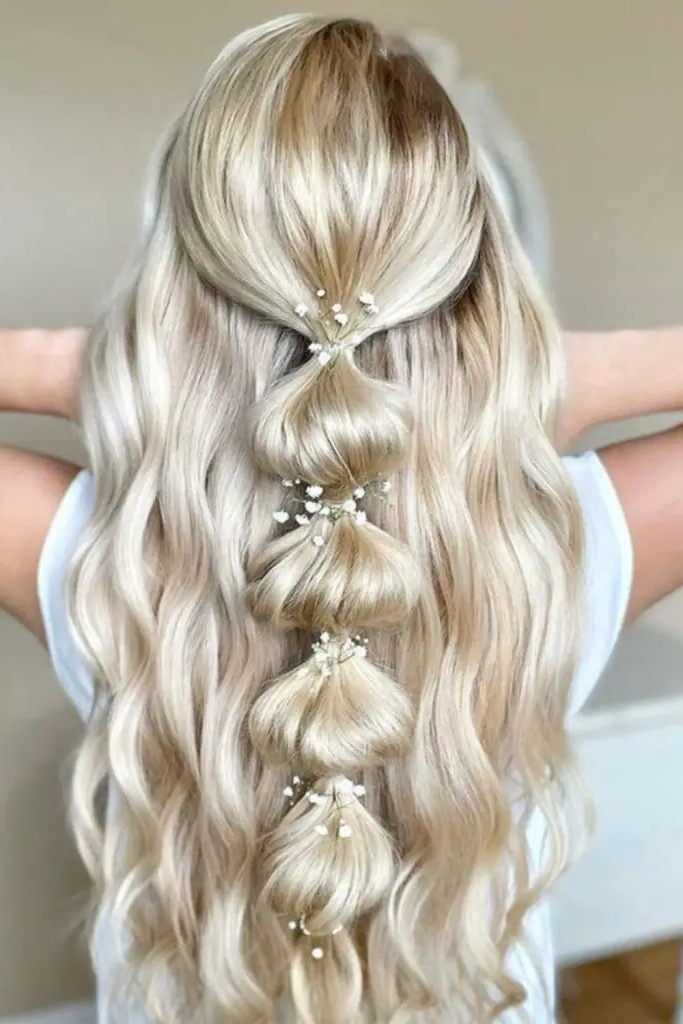 27 Simple Hairstyles for Long Hair 24 22. Layered Topsy Tail Wonder