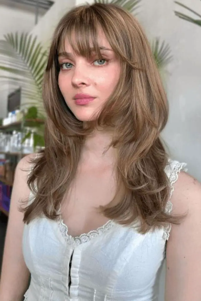 29 Stunning Butterfly Bangs Hairstyles 25 23. Layered Butterfly Bangs: Soft Yet Structured