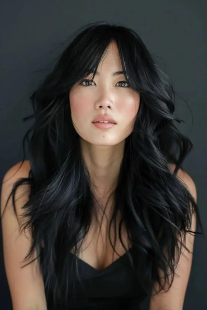 29 Long Layers with Curtain Bangs 26 25. Charcoal Veil Waves