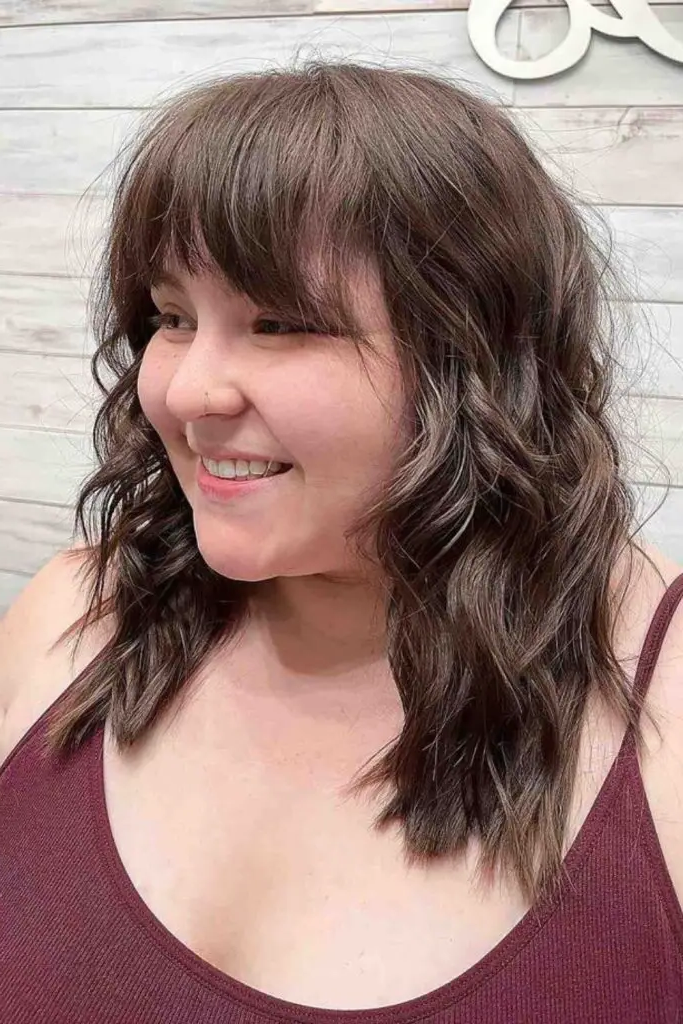27 Gorgeous Haircuts for Round Chubby Faces 29 27. Layered Shag with Soft Fringes