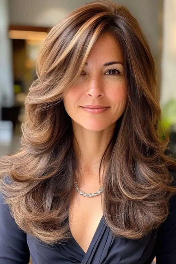 28 Best Feathered Layered Hairstyles 30 28. Feathered Layers with Tousled Ends: Messy Elegance