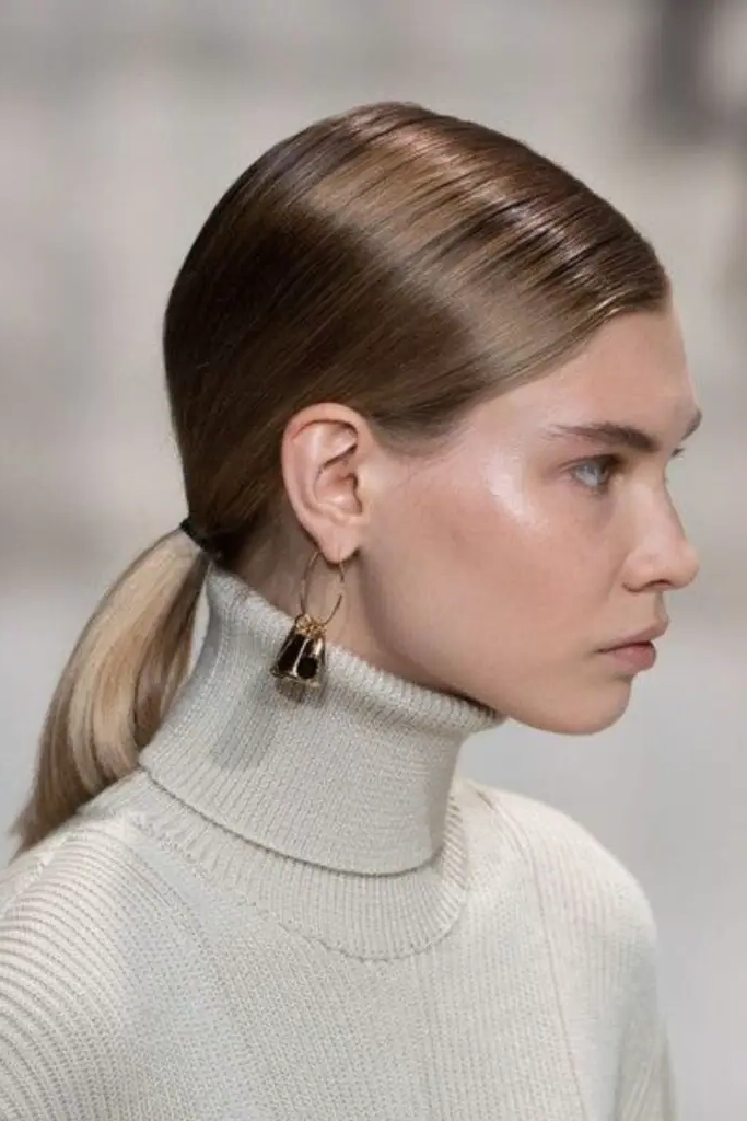 27 Stunning Turtle Neck Hairstyles 6 4. Slicked Back Elegance Meets Structured Layers