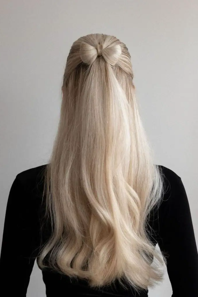 28 Cute Hairstyles with a Bow 7 5. Half-Up Bow Chignon