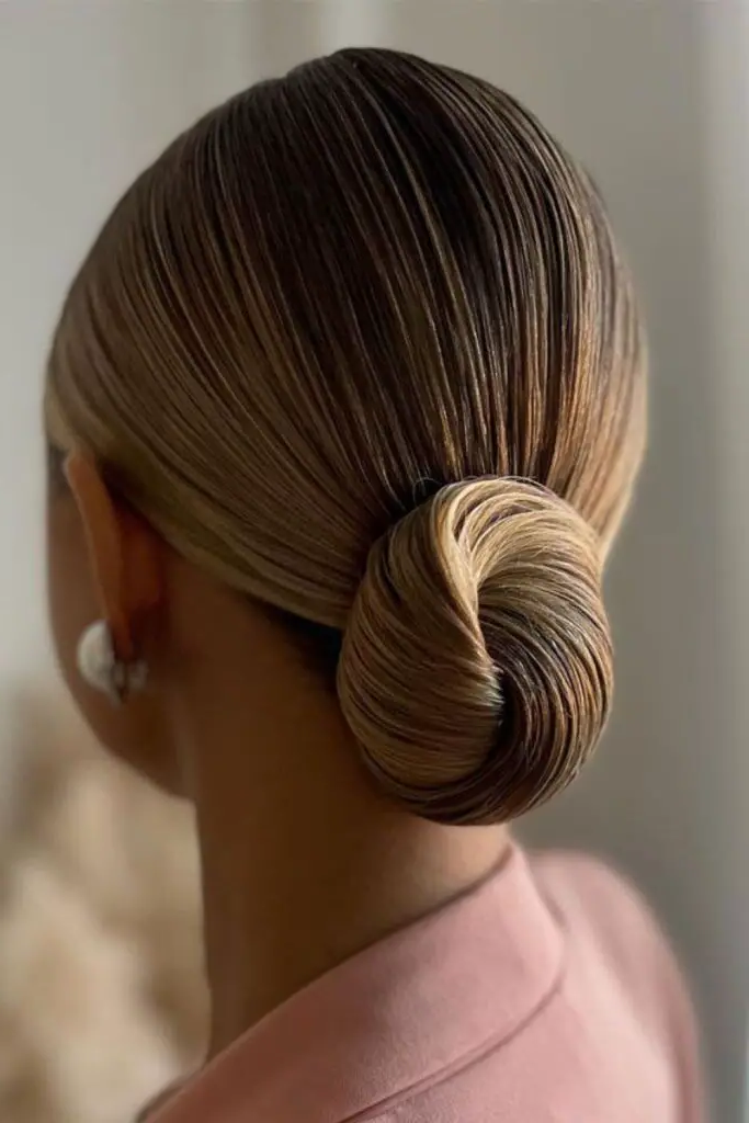 29 Top Spring Hairstyles for 2025 8 6. Sleek Low Bun with a Twist