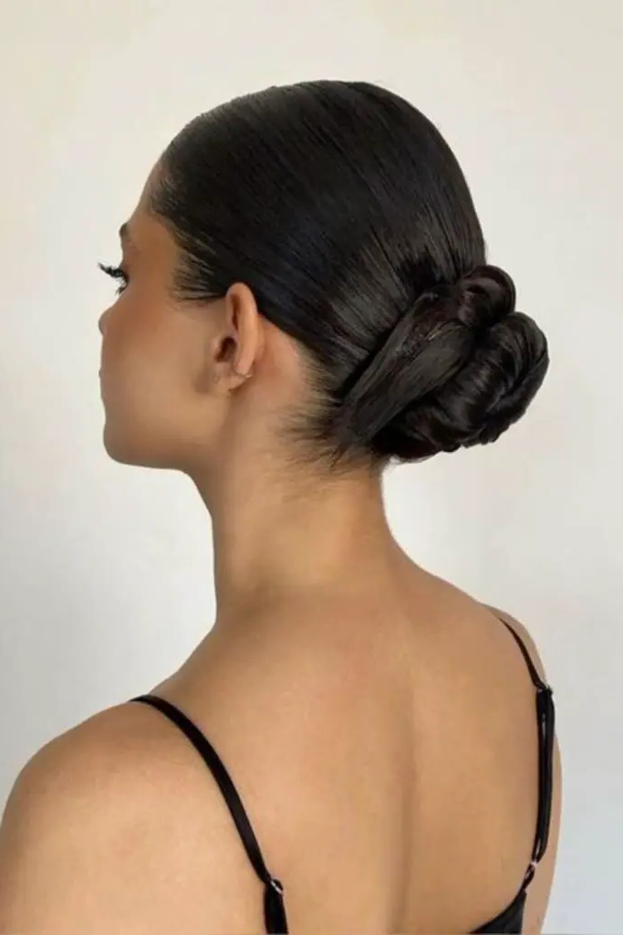 27 Easy Latina Hairstyles 8 6. Slicked Back Low Bun