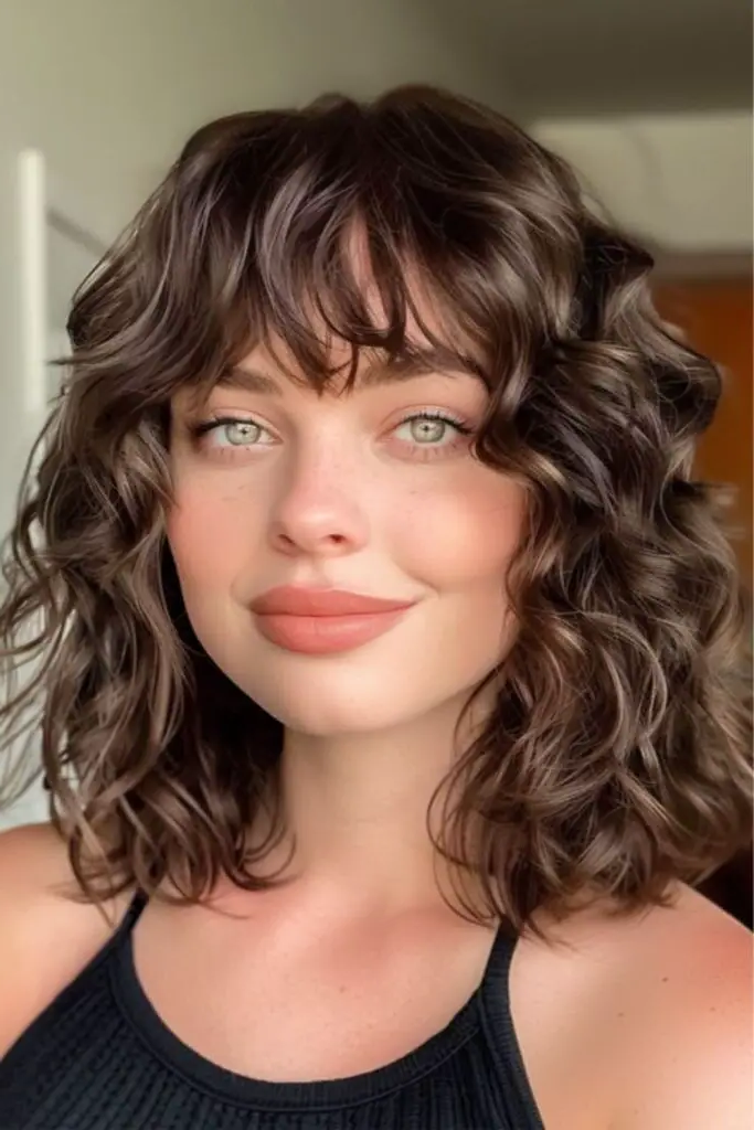 27 Best Lob Haircut with Bangs 8 6. Vintage Soft Curl Enchantment