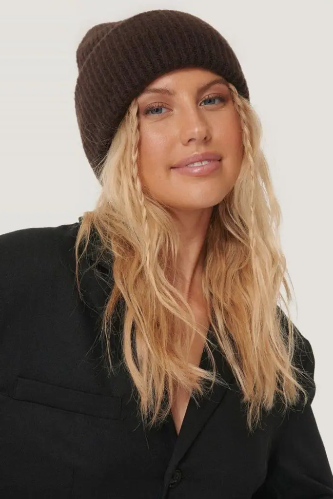 8. Messy Curls Under a Beanie