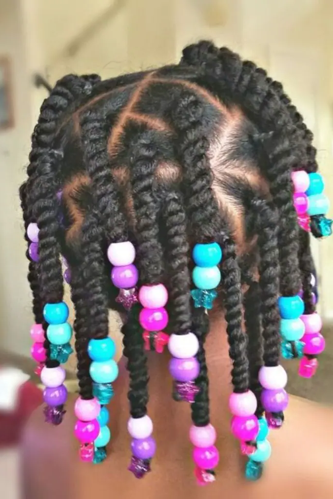 27 Cutest Toddler Beaded Hairstyles for Kids 10 8. Side-Swept Beaded Twists