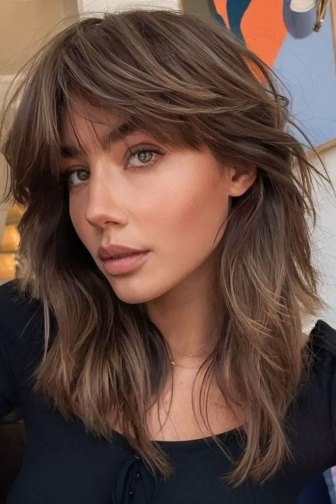 27 Gorgeous 2025 Haircuts for Women 10 8. Voluminous V-Cut