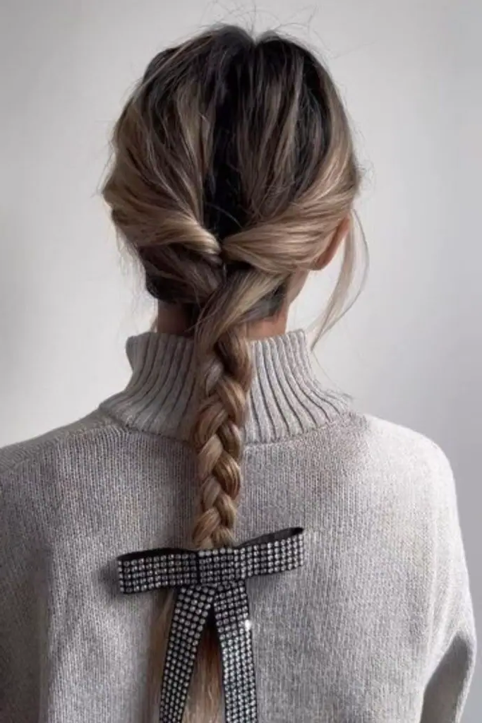 28 Cute Hairstyles with a Bow 11 9. Bow-Tied Fishtail Braid