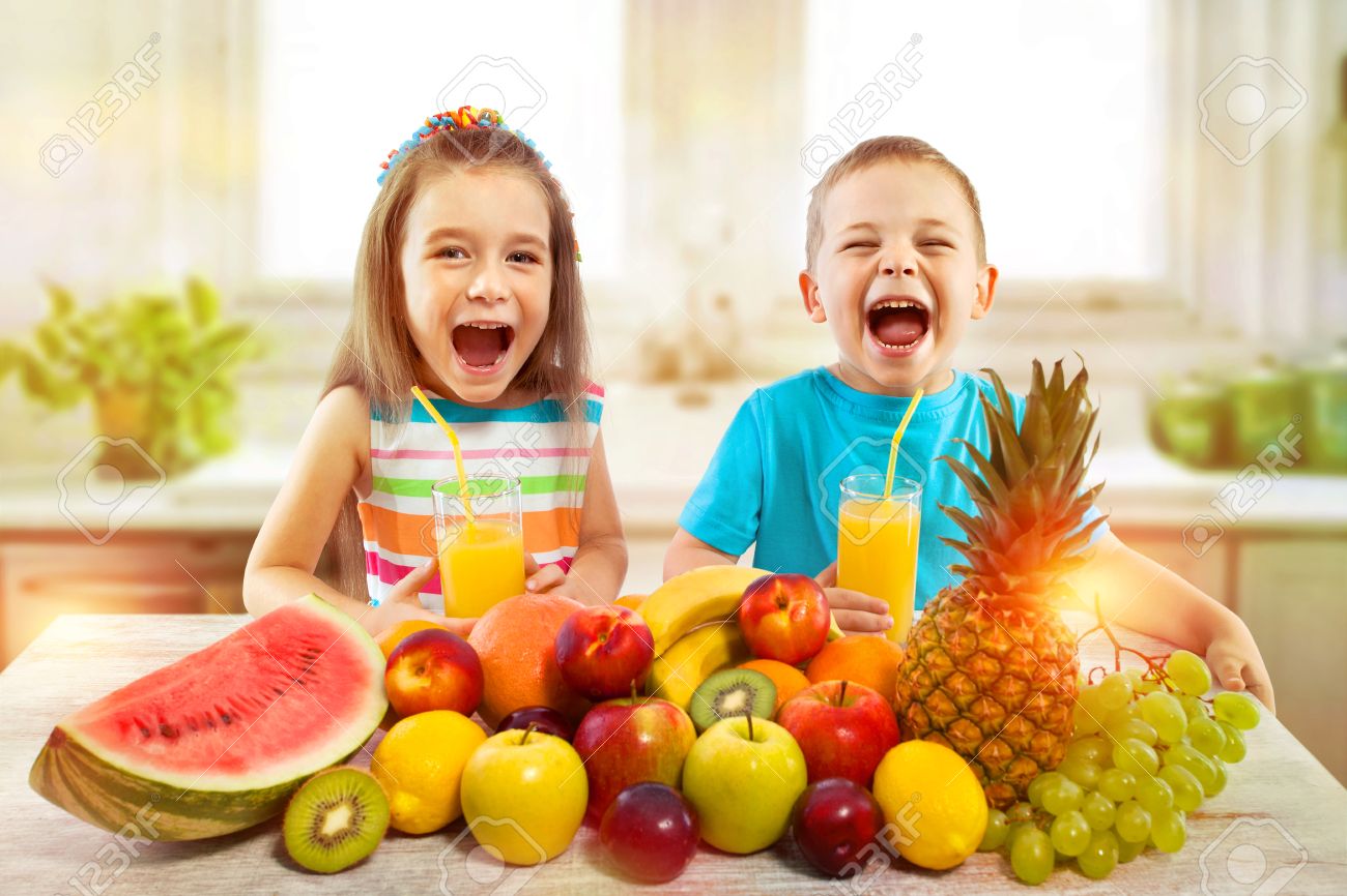 How to Encourage Healthy Habits in Kids 1 66088295 happy children with fruits and fresh juice in kitchen kids healthy eating concept