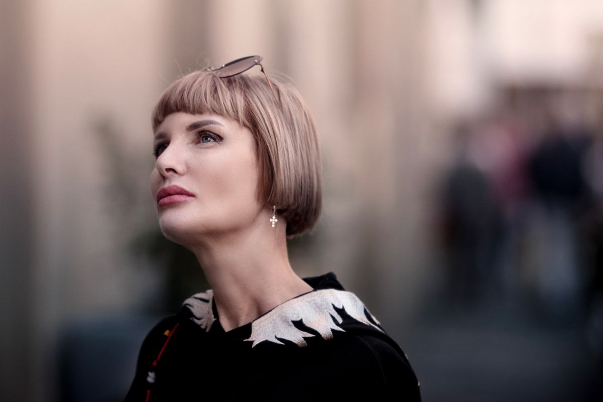 Ash Blonde Balayage: The Ultimate Modern Hair Color Trend for Women 2 Woman with an ash blonde bob haircut