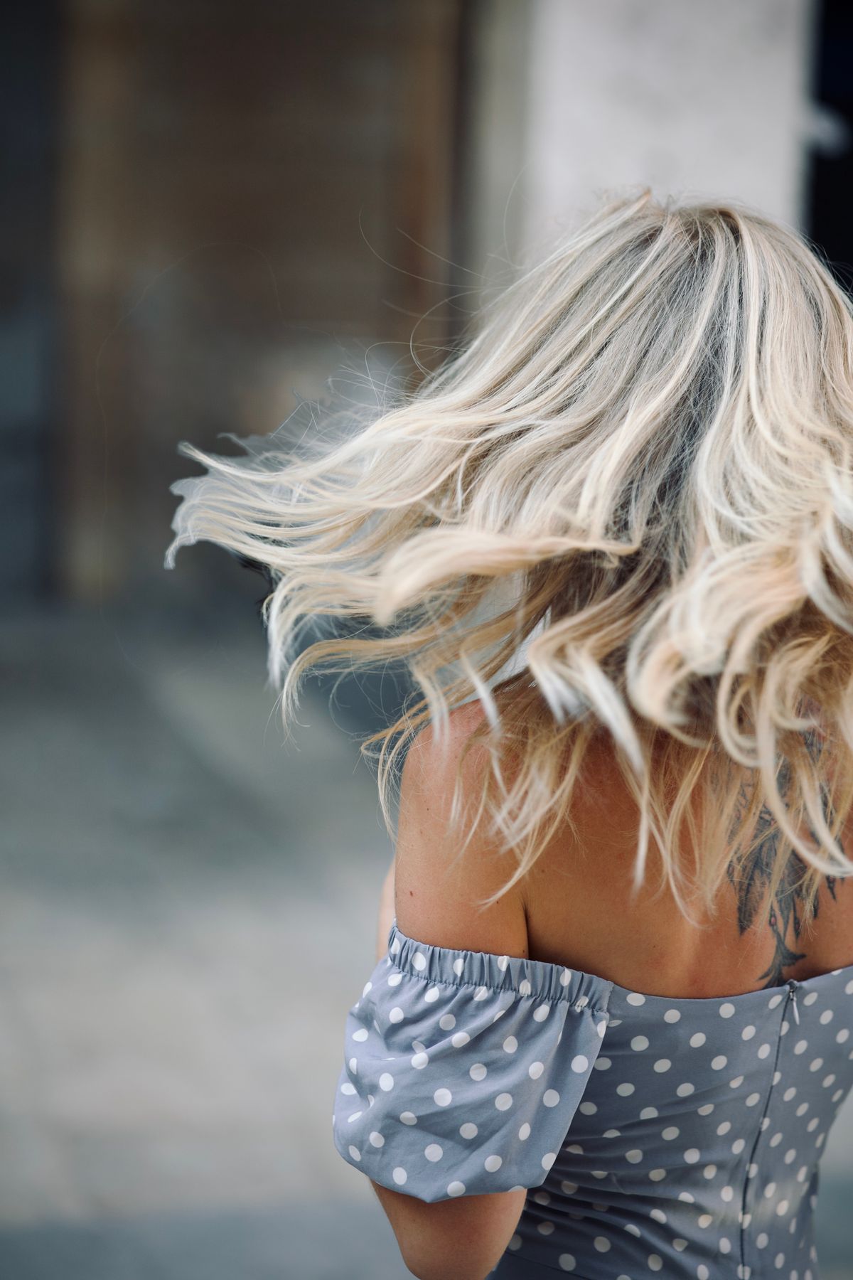 The Beauty of Ash Blonde Hair Color for Women 2 Woman with flowing ash blonde hair outdoors