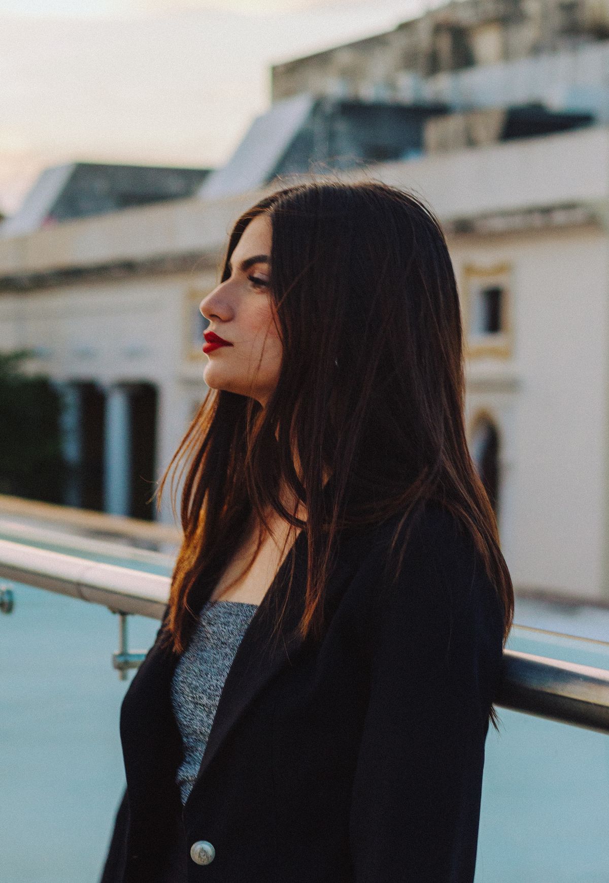 The Soft Beauty of Ash Brown Hair Color for Women 2 Profile of a woman with ash brown hair in a suit jacket