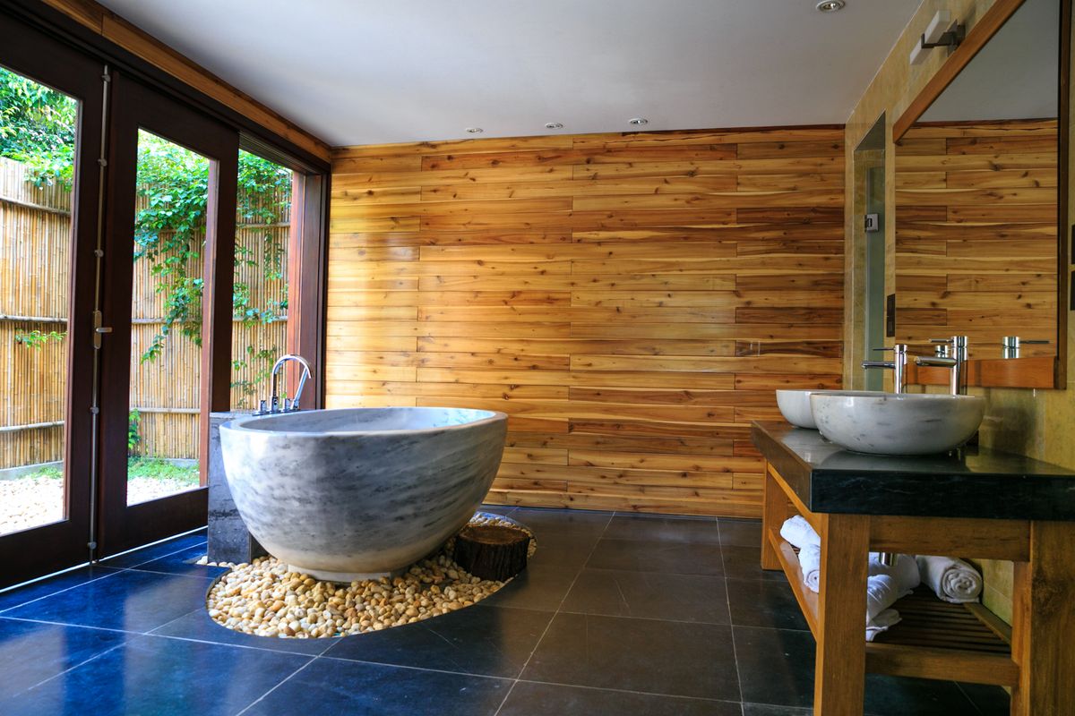 Luxury Bathroom Home Decor Ideas for a Spa-Like Experience 3 Elegant bathroom with marble tub and wooden interior accents