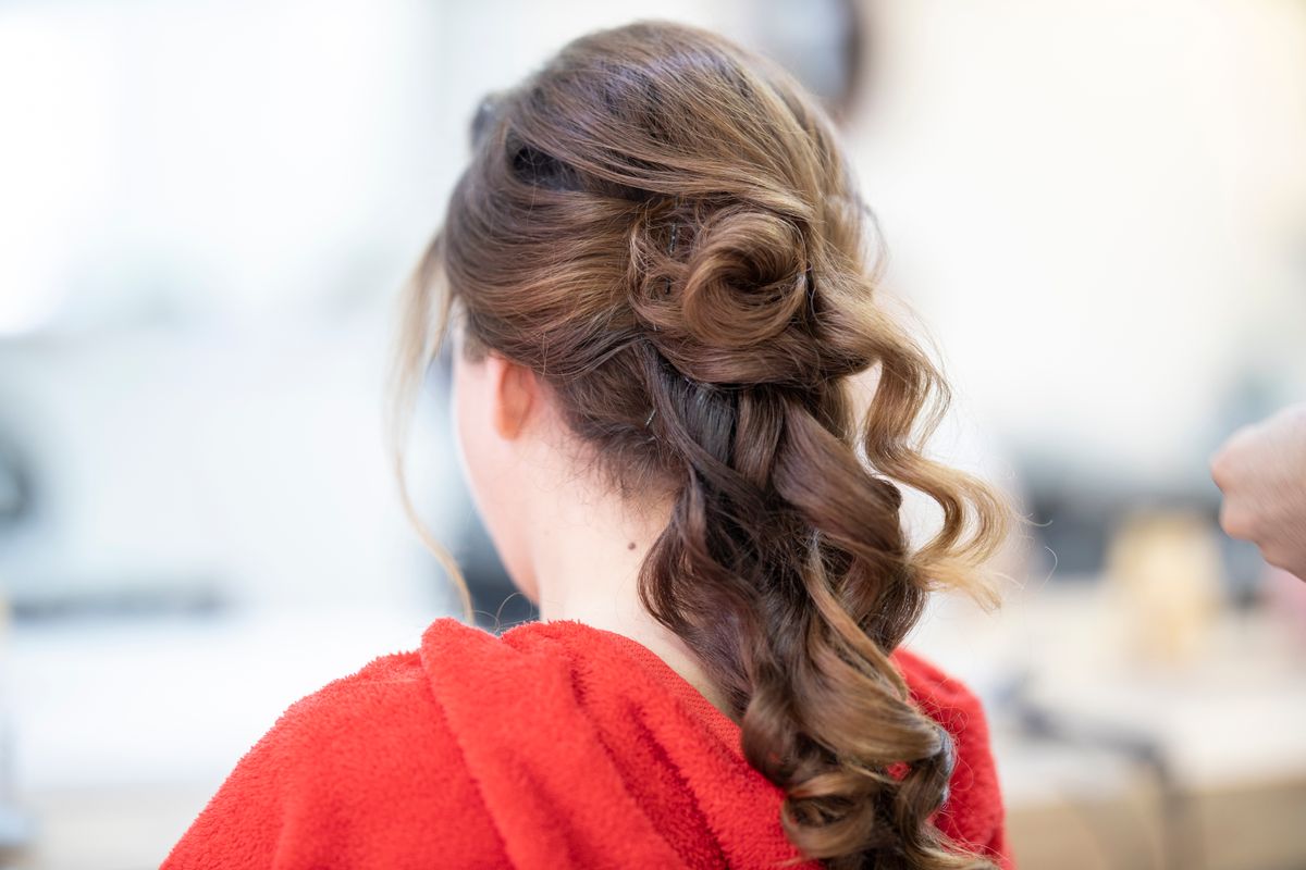 Chocolate Brown Hair: A Timeless Blend of Depth, Shine, and Natural Elegance 2 Elegant hairstyle featuring curls and a braid