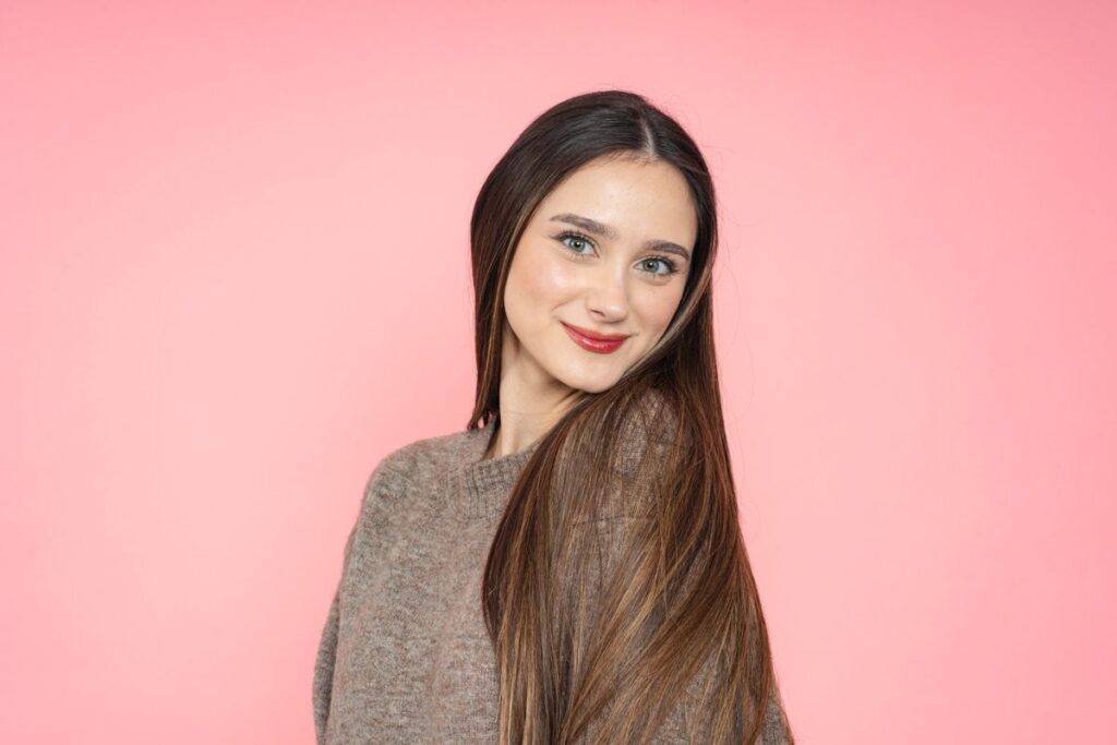 Smiling woman with long chocolate brown hair