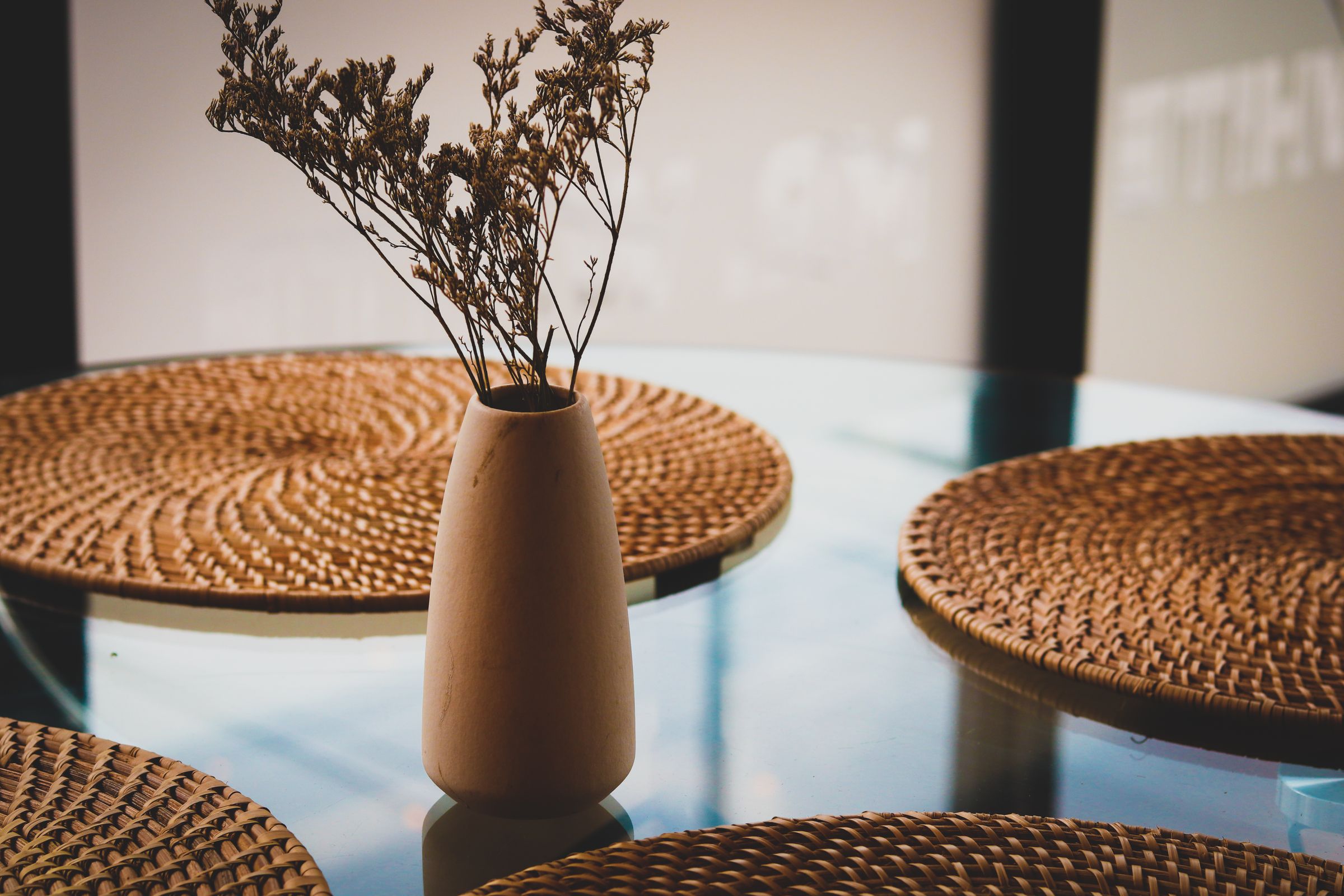 Dining Room Decor Ideas That Make Every Meal Feel Special 8 Simple low vase with dried flowers on a dining table