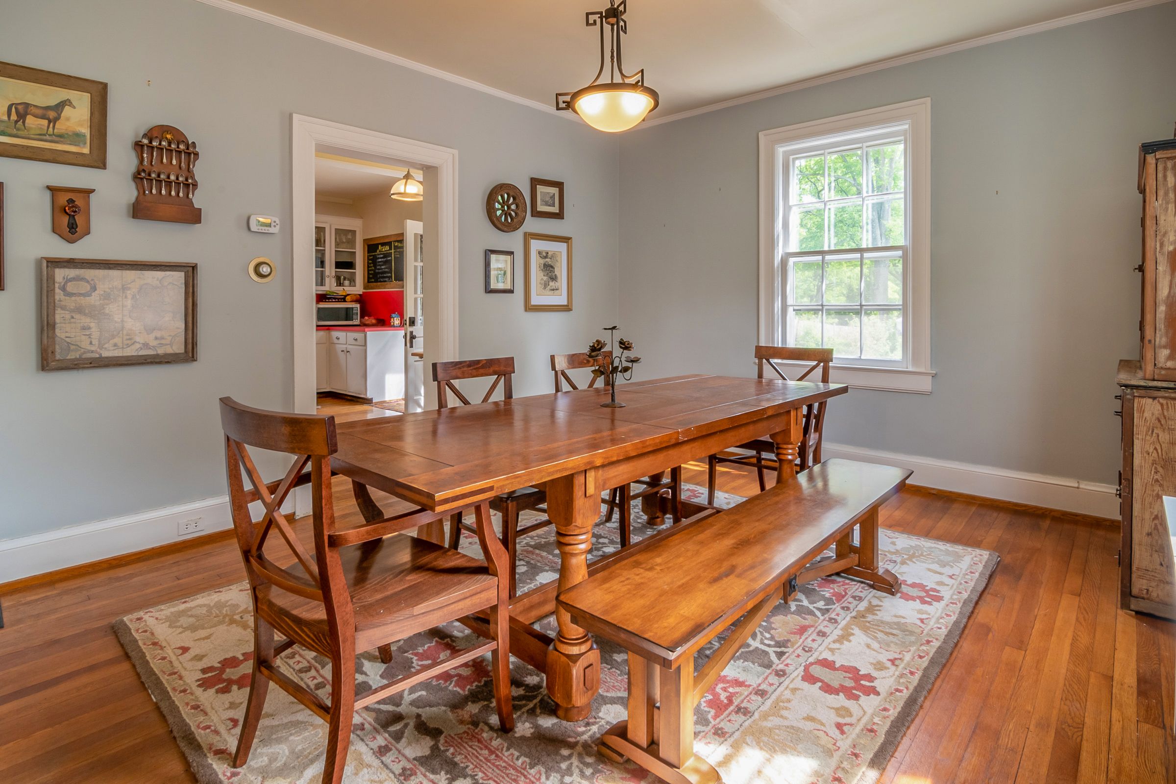 Dining Room Decor Ideas That Make Every Meal Feel Special 5 Patterned rug under a wood dining table and bench