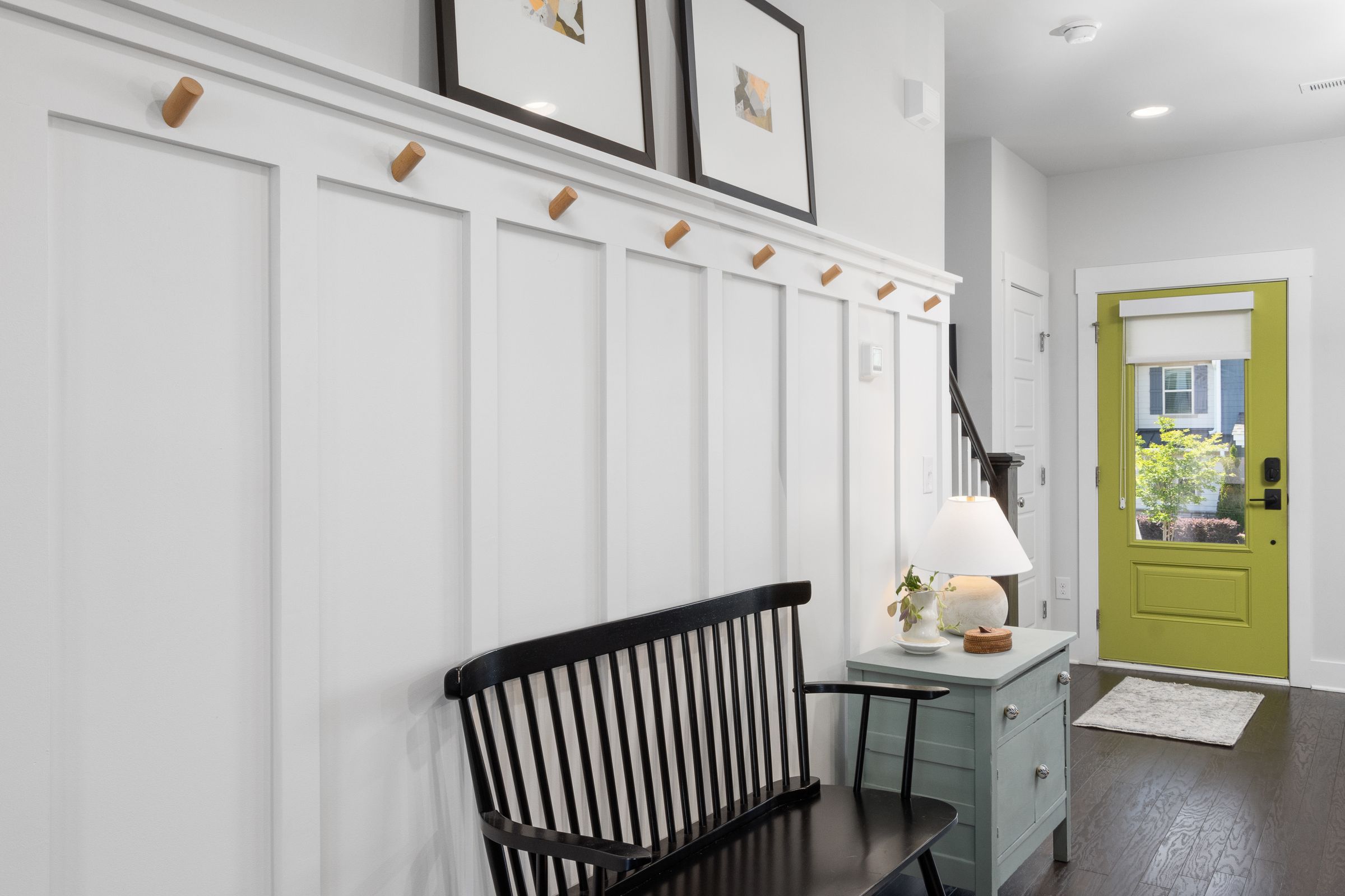 Entryway Decor Ideas That Make a Small Space Feel Welcoming 7 Entryway bench with framed art and a lamp for personal touches