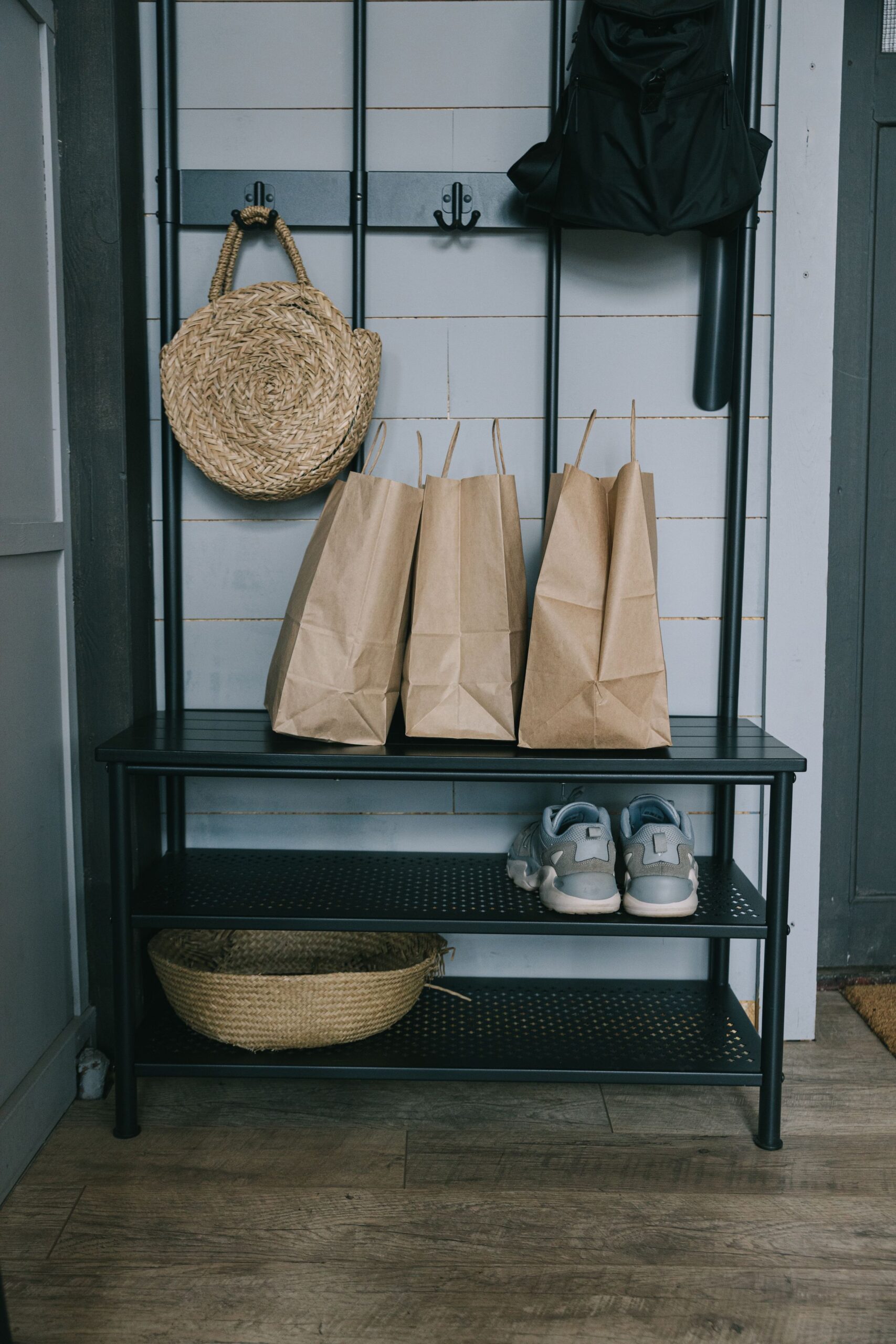 Entryway Decor Ideas That Make a Small Space Feel Welcoming 5 Entryway storage bench with shoes, bags, and woven baskets