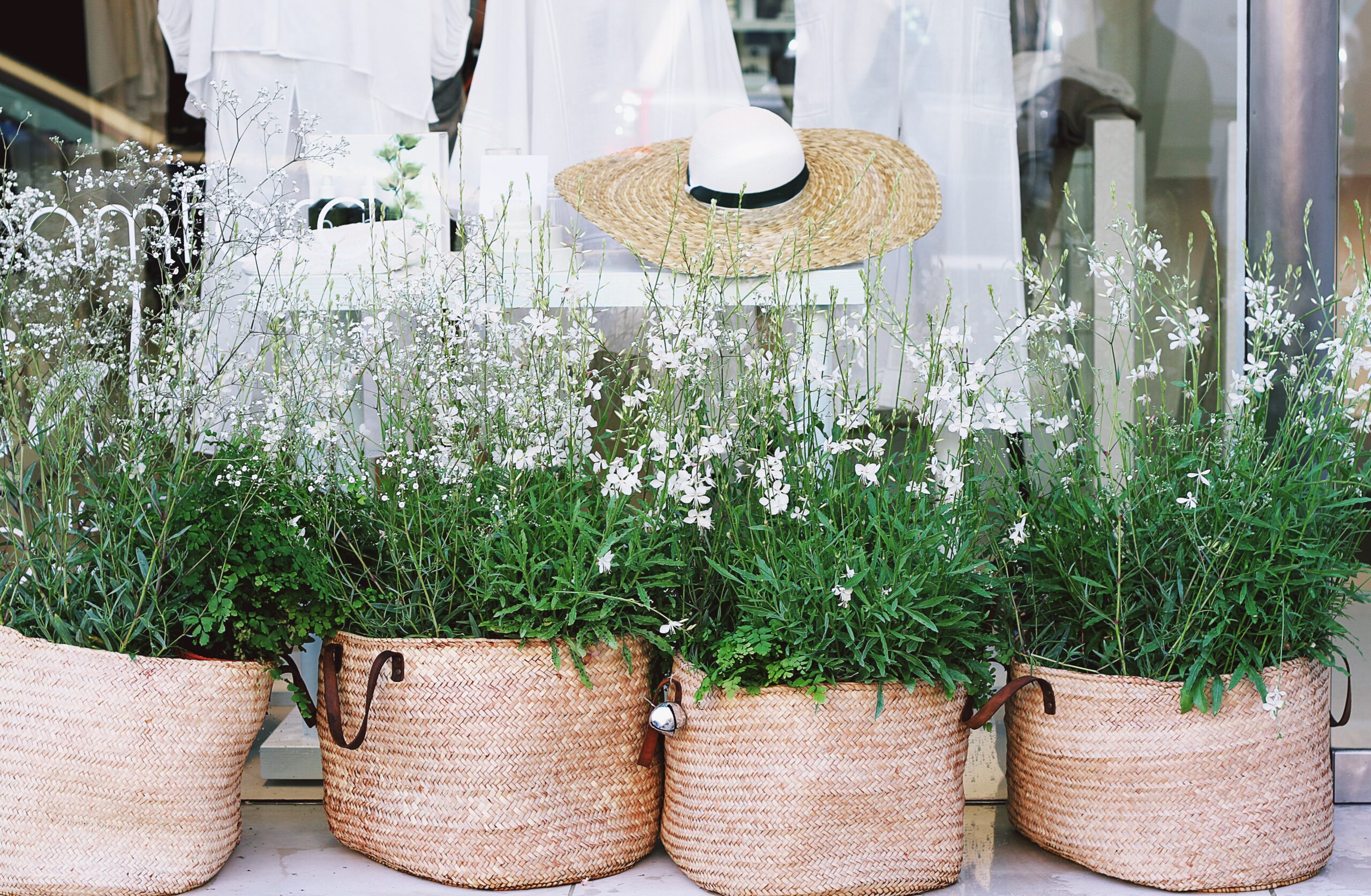 7 Fall Garden Ideas That Actually Last 7 Wicker planters with plants on an outdoor patio