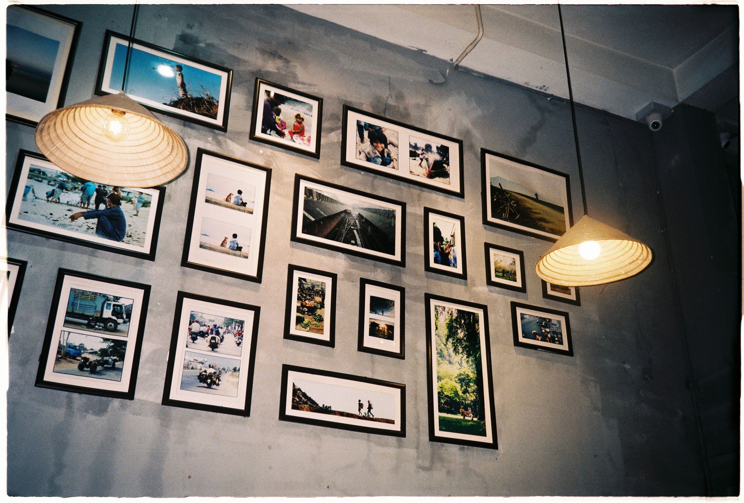Picture frames arranged on a gray wall