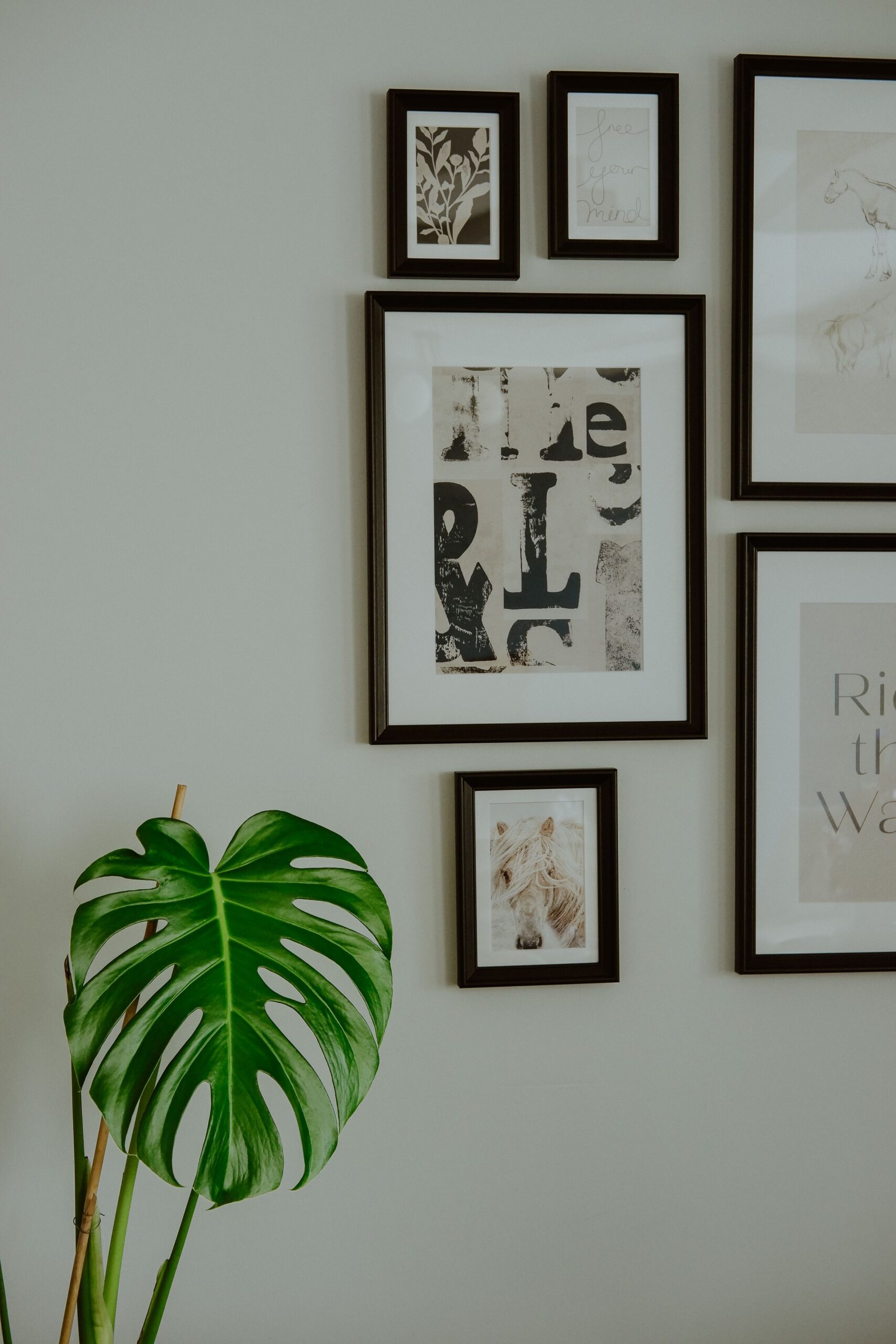 Framed painting displayed on a wall in a home