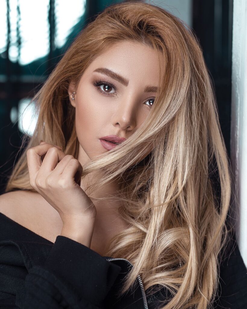 Close-up of a woman with honey blonde hair