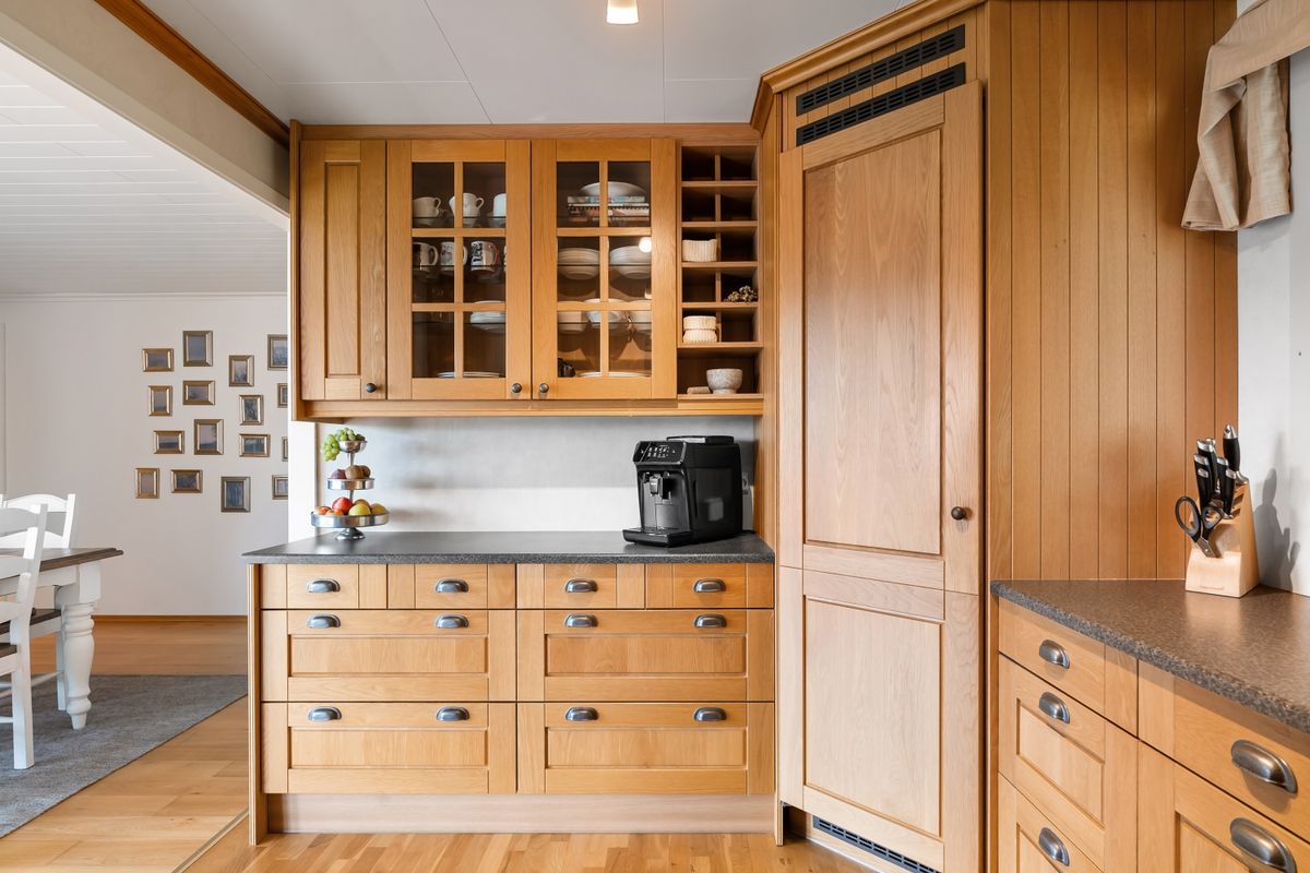 Elegant kitchen interior with oak wood cabinets