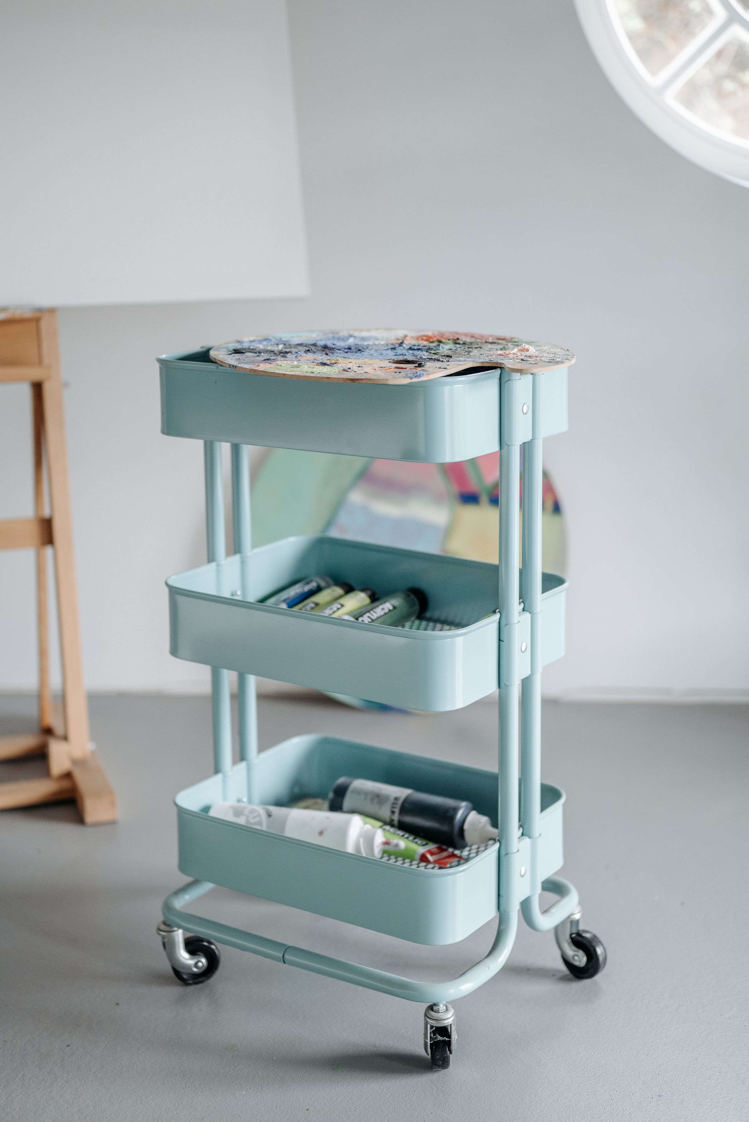 Laundry Room Organization Ideas That Actually Make Sense 4 Teal three-tier rolling storage cart with wheels