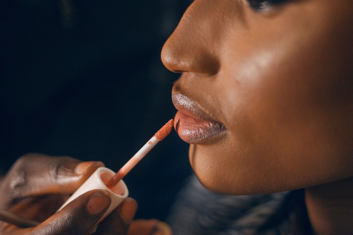 The Beauty of Lipstick, Lip Combos, and Lip Gloss: A Complete Guide for Women 2 Close-up of glossy lipstick being applied to lips