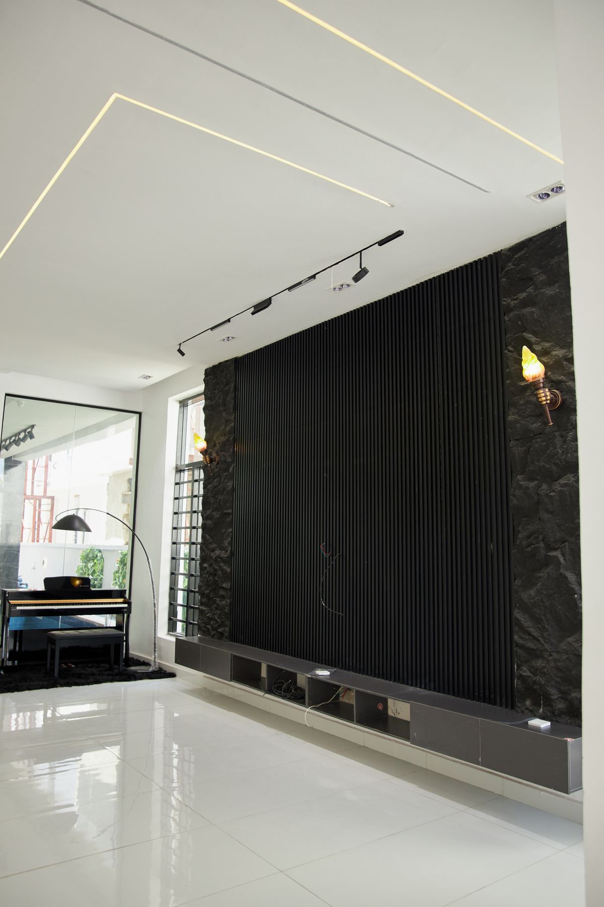 Sleek modern interior with a black accent wall
