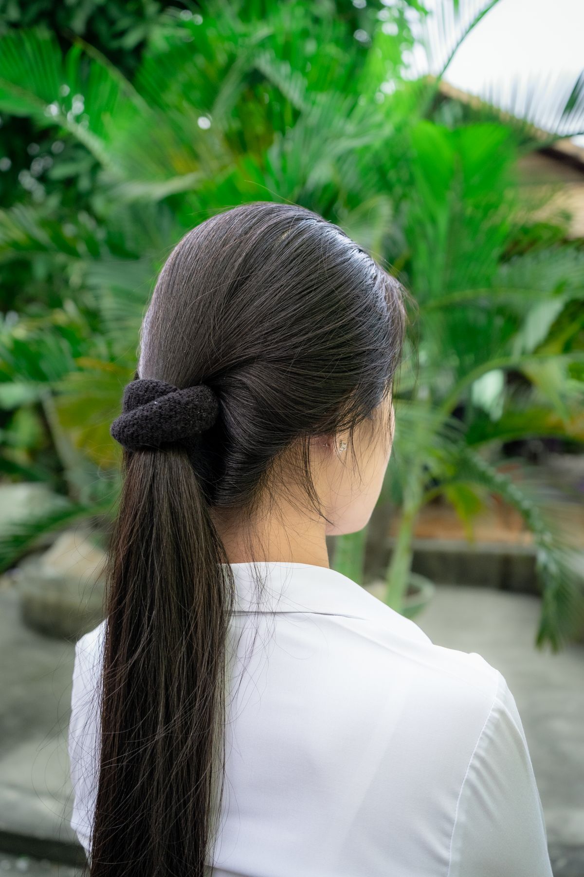 The Timeless Beauty of Long Layered Hair Style for Women 7 Woman with long layered hair in a ponytail outdoors