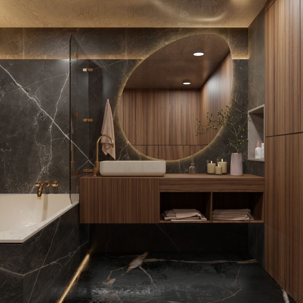 High-end bathroom with marble finishes, round mirror, and wooden accents