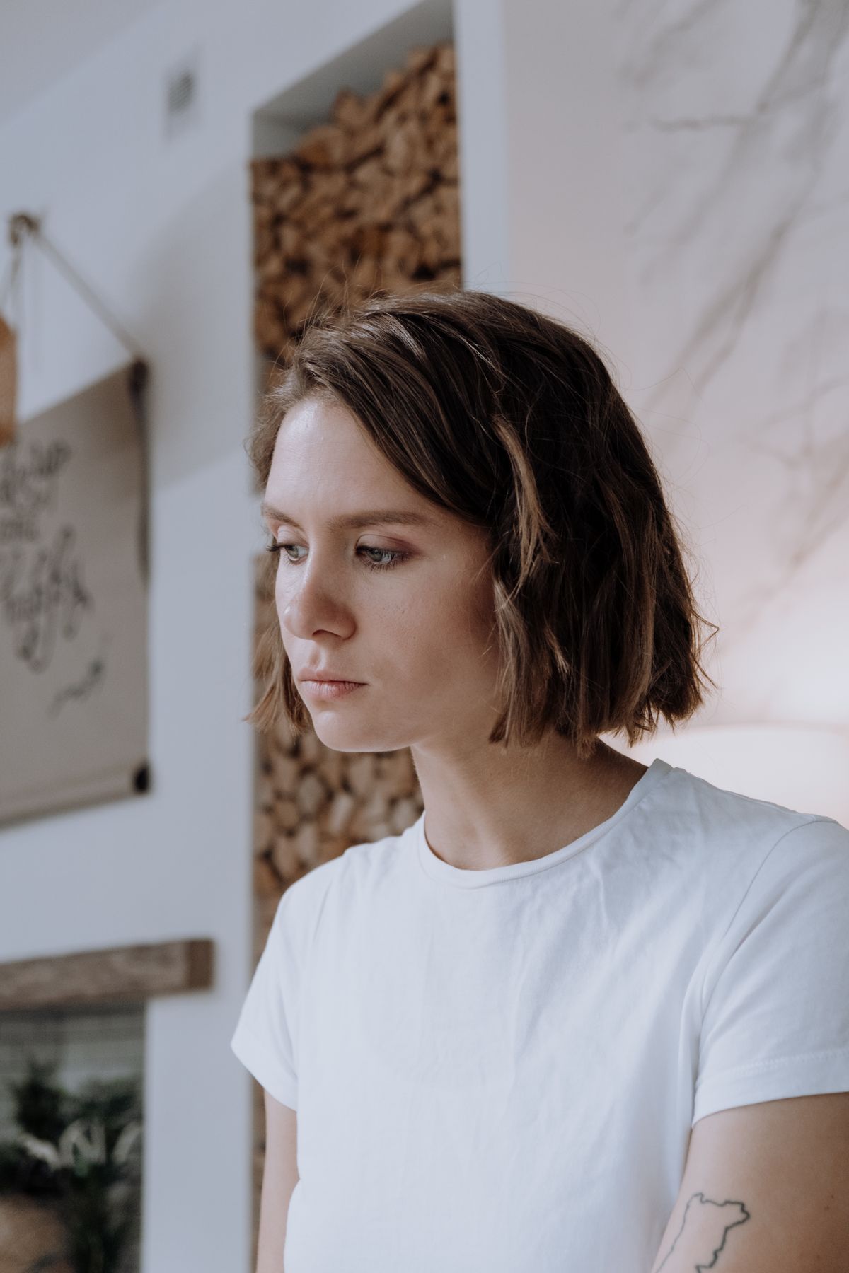 The Modern Bob Haircut for Women: A Timeless & Stylish Hair Transformation 7 Woman with a styled bob haircut in a white t-shirt