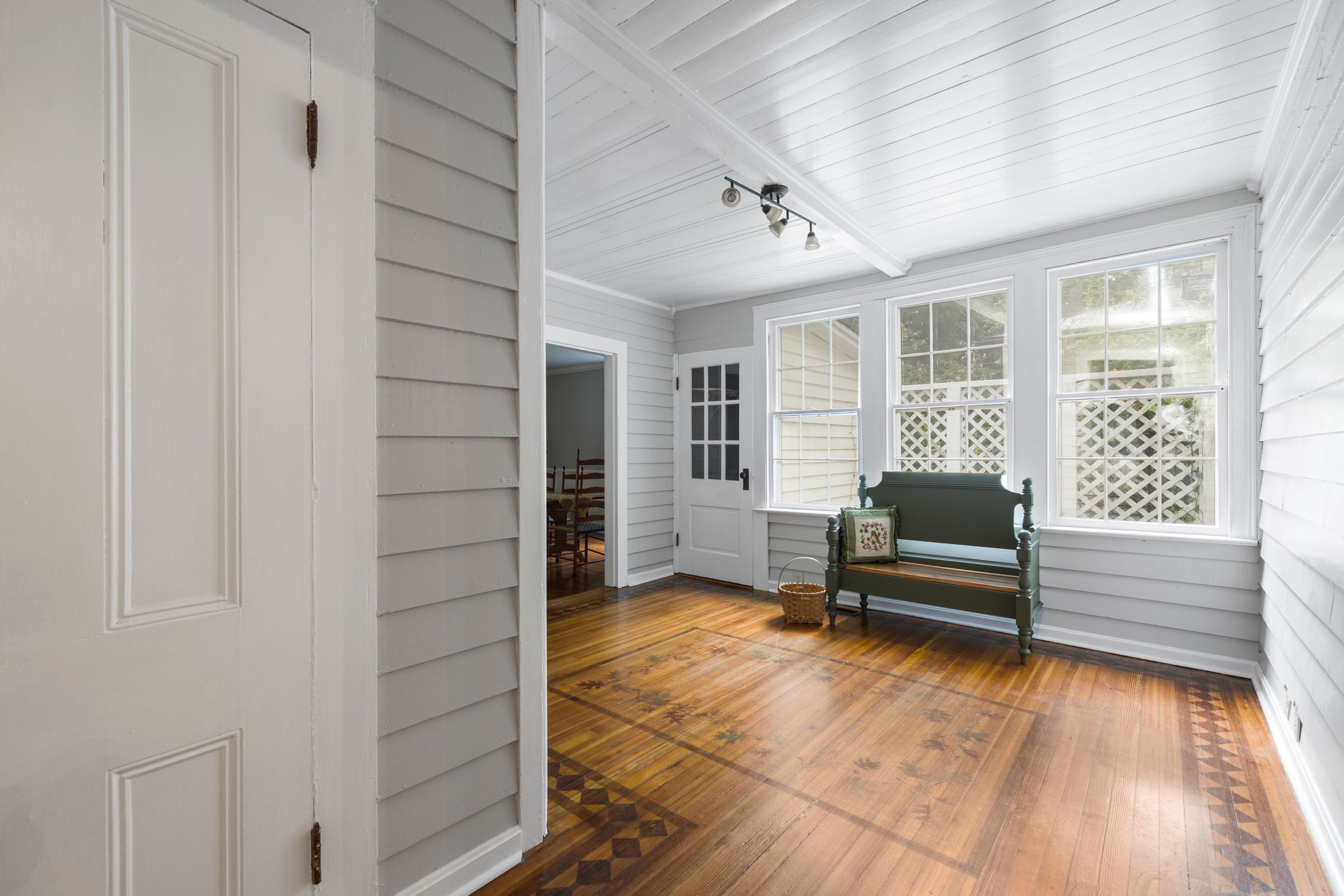 7 Mudroom Organization Ideas That Actually Make Sense 2 Green wooden bench used for a mudroom seating area