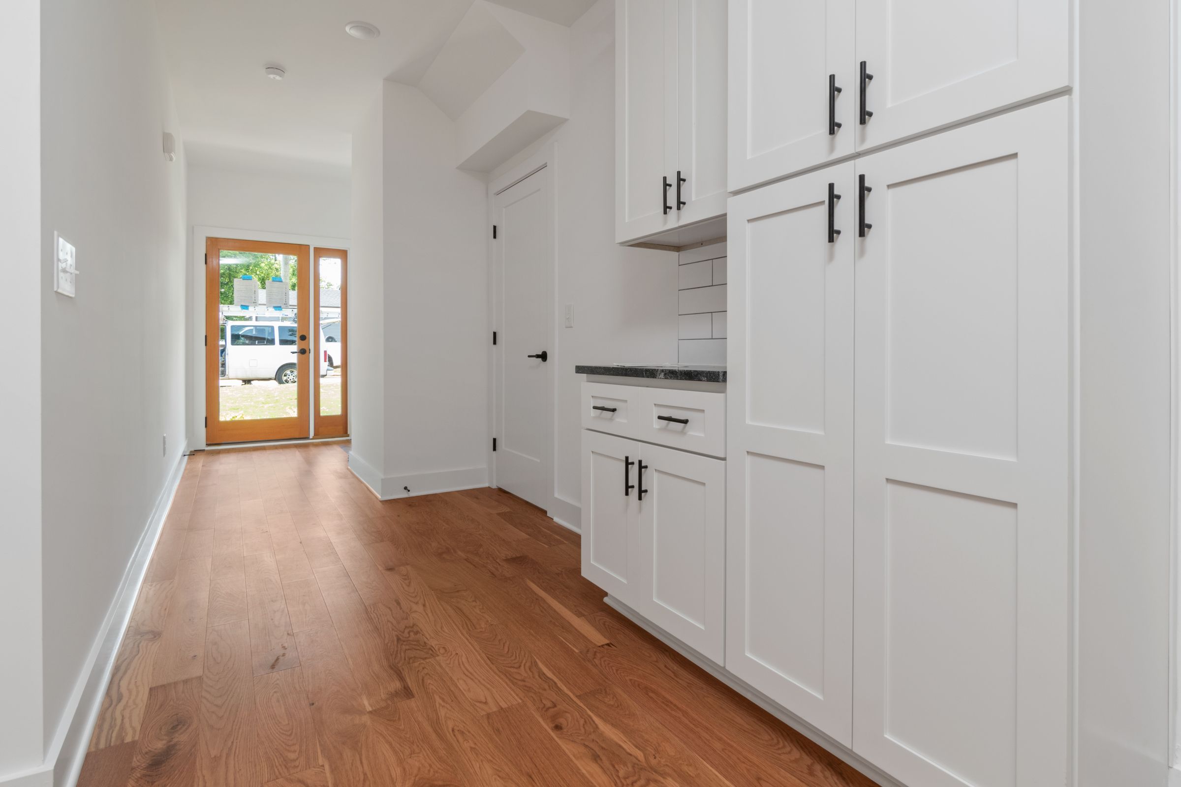 7 Mudroom Organization Ideas That Actually Make Sense 7 White wooden storage cabinet against a wall