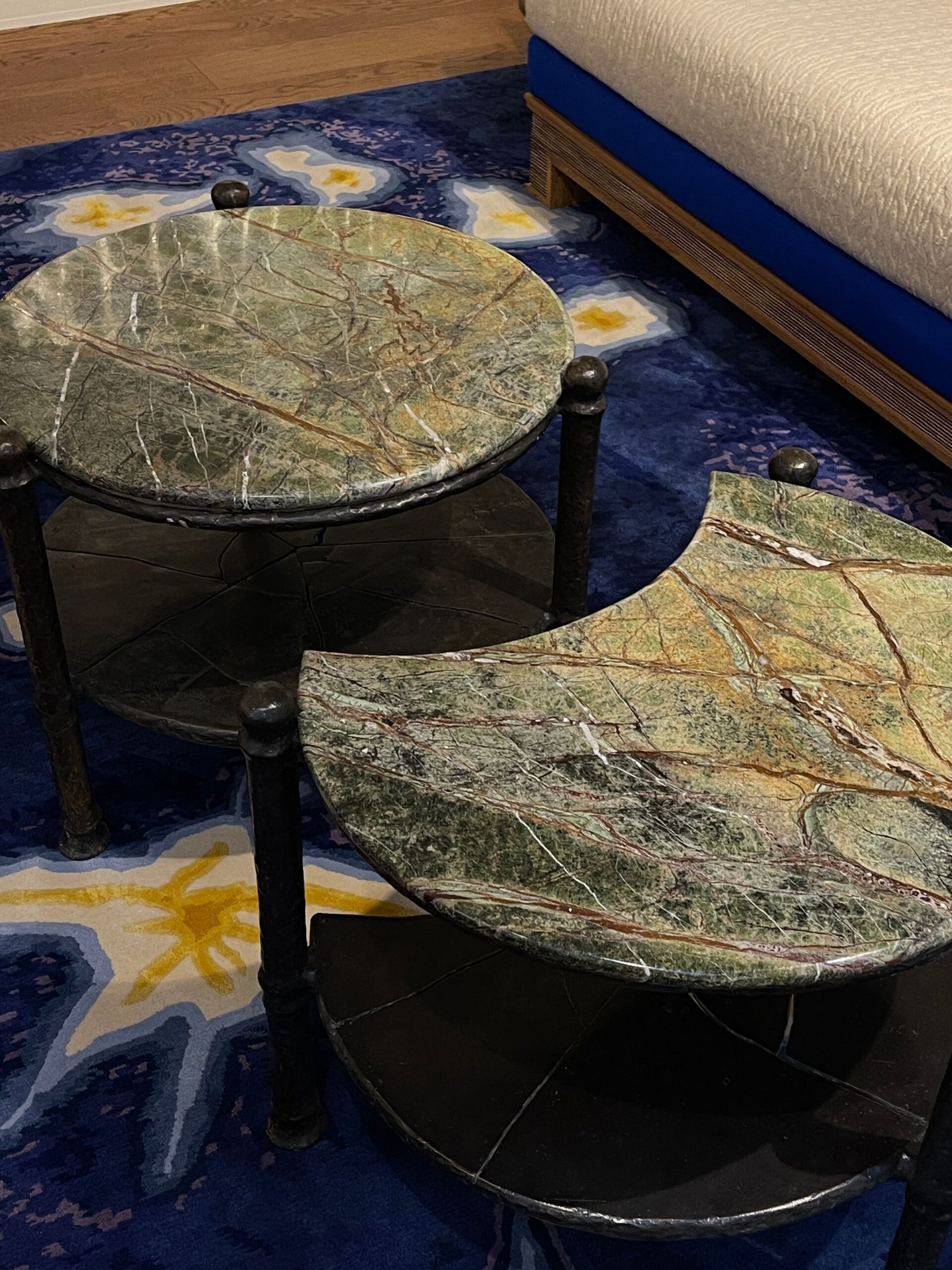 Marble surface tabletop with rich wood tones nearby