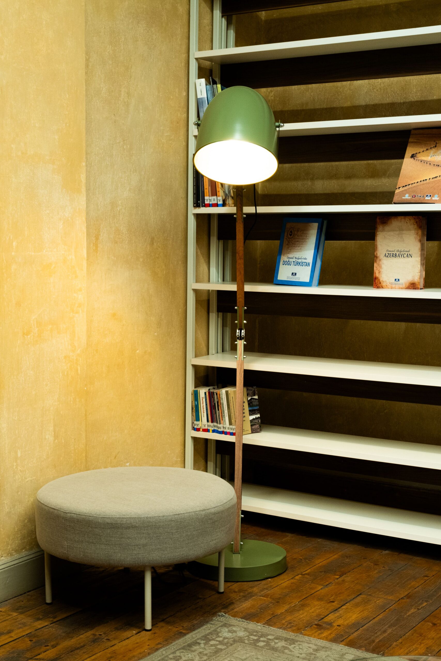 7 Cozy Reading Nook Ideas That Make You Want to Sit Down and Stay 5 Cozy reading corner lit by a modern floor lamp